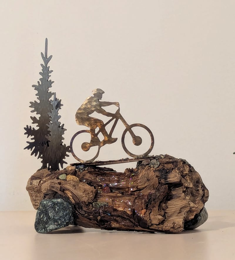 Lone Cyclist Over Bridge